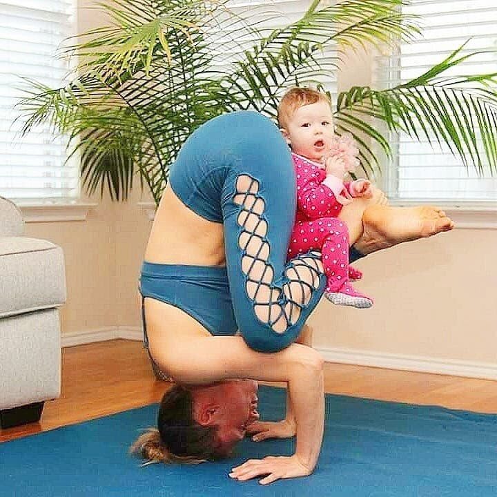 Woman in a forearm inversion with her baby on a large Oasis Blue yoga mat