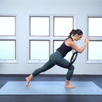 Woman in a lunge with a resistance ring on a large Silverback Gray exercise mat