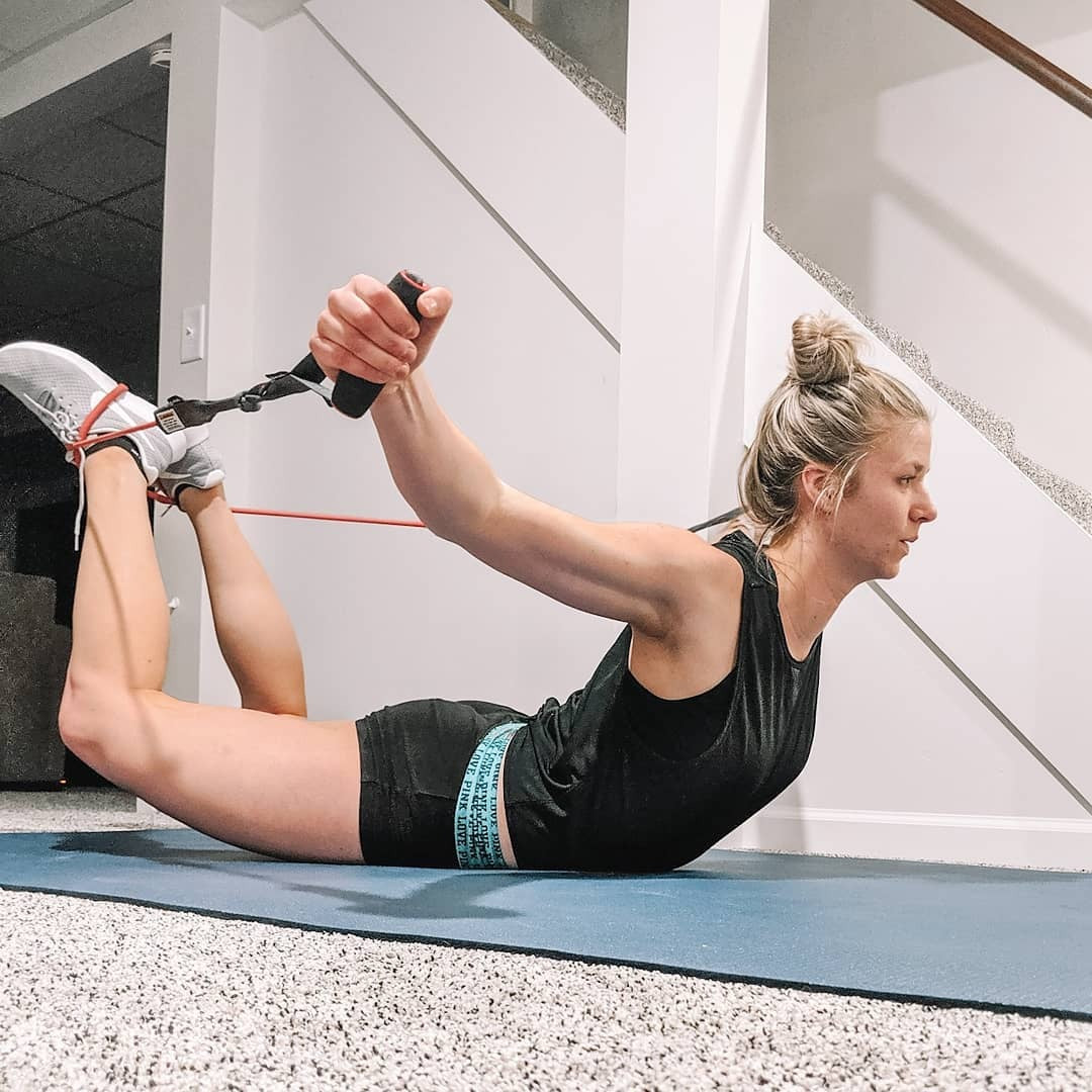 Woman in a banded bow stretch on a large Silverback Gray exercise mat