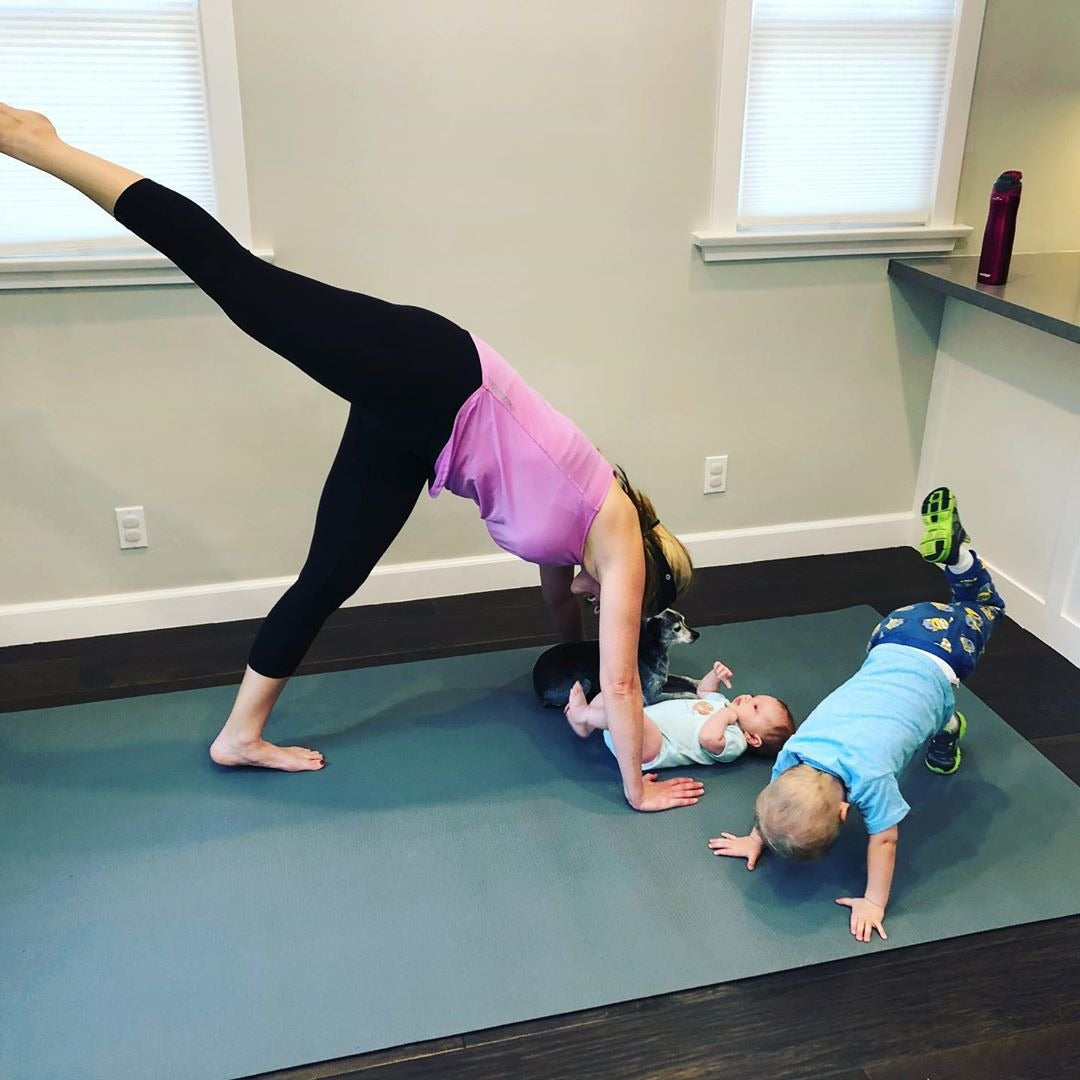 Mom and kids doing leg raises on a large Silverback Gray exercise mat