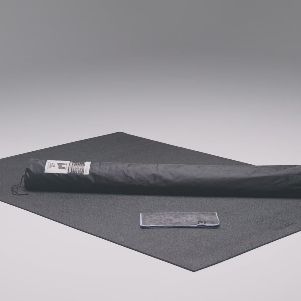 Large yoga mat in use, barefoot yoga poses
