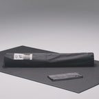 Large exercise mat in use with shoes and kettlebells