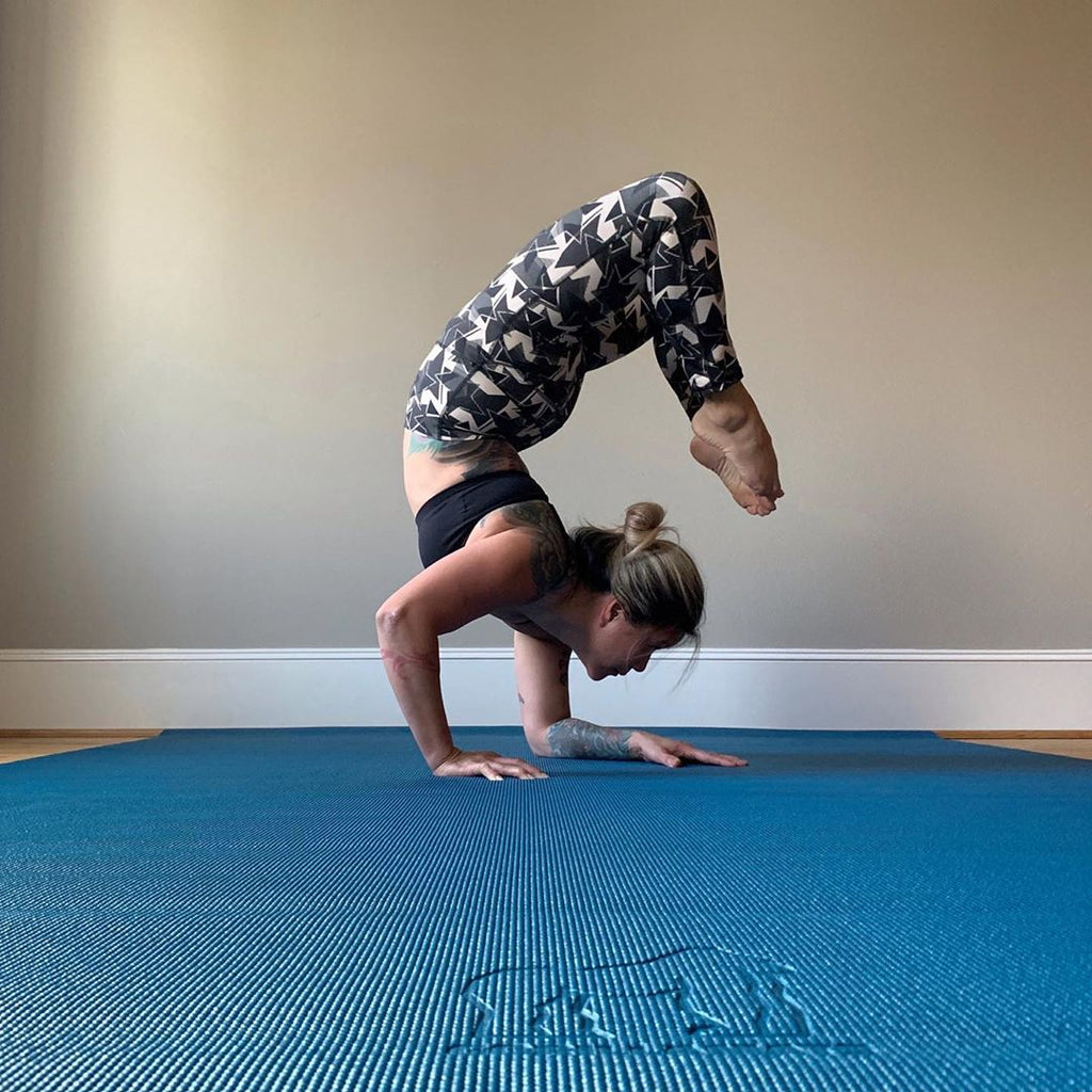 Handstand on a blue Yo Gorilla Mats yoga mat